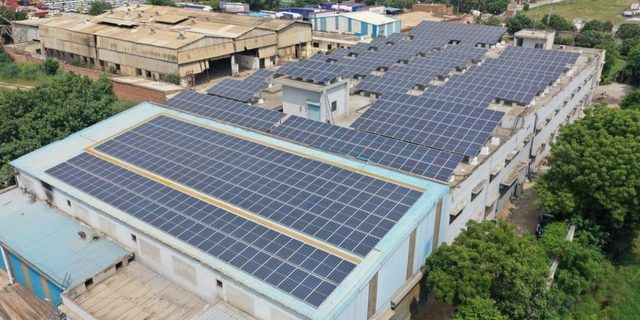 Solar array covering an industrial shed roof