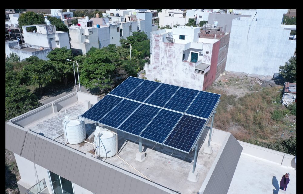Aerial view of a rooftop solar array on a home in Gujarat